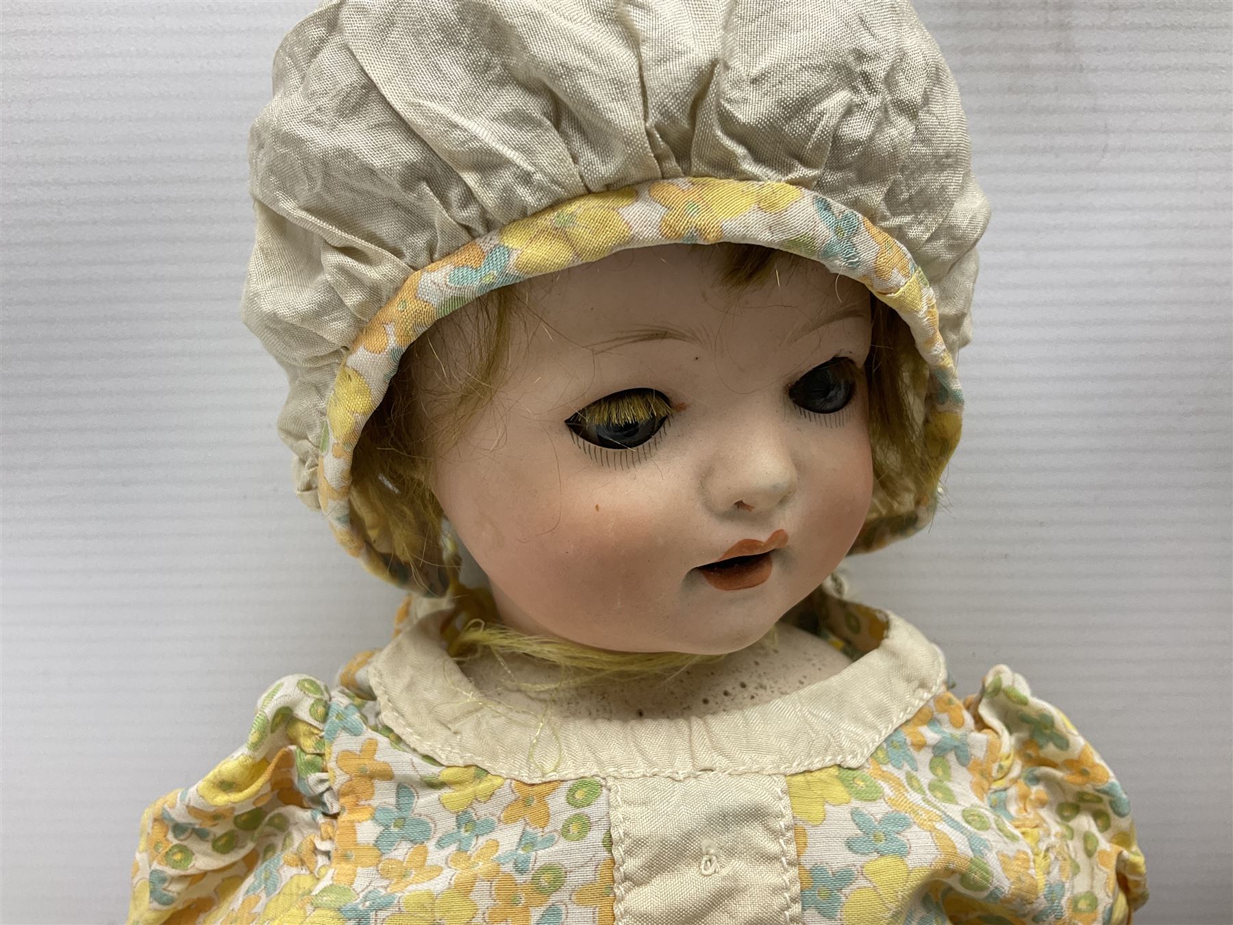 Carl Harmus Germany bisque head doll with applied hair, sleeping eyes, open mouth with teeth and composition body with jointed limbs; marked 'Harmus 313.4/0 Germany' H38cm; and Alt, Beck & Gottschalk Germany bisque head doll with applied hair, fixed eyes, open mouth with tongue and composition body with jointed limbs H44cm (2)