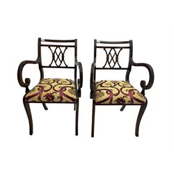 Regency design mahogany twin pedestal dining table, rectangular top with reeded edge, acanthus carved turned column terminating in reeded tripod base with hairy paw feet and castors (W172cm D92cm H75cm) and set eight (6+2) Regency design mahogany dining chairs, pierced back with scroll design, seat upholstered in patterned laurel green fabric, raised on reeded sabre supports (W48cm H88cm)