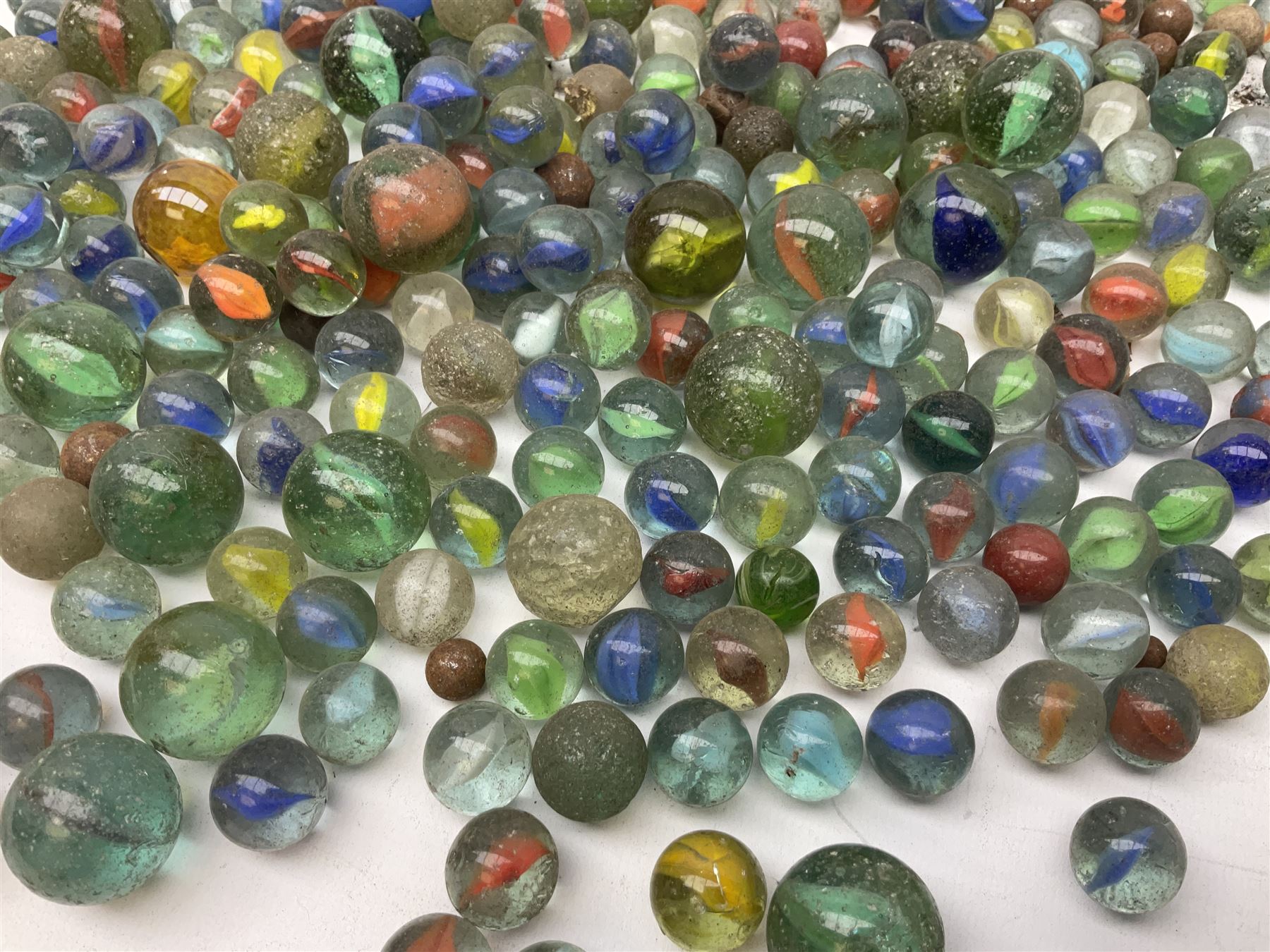 Collection of marbles with multi-coloured latticino or onionskin decoration