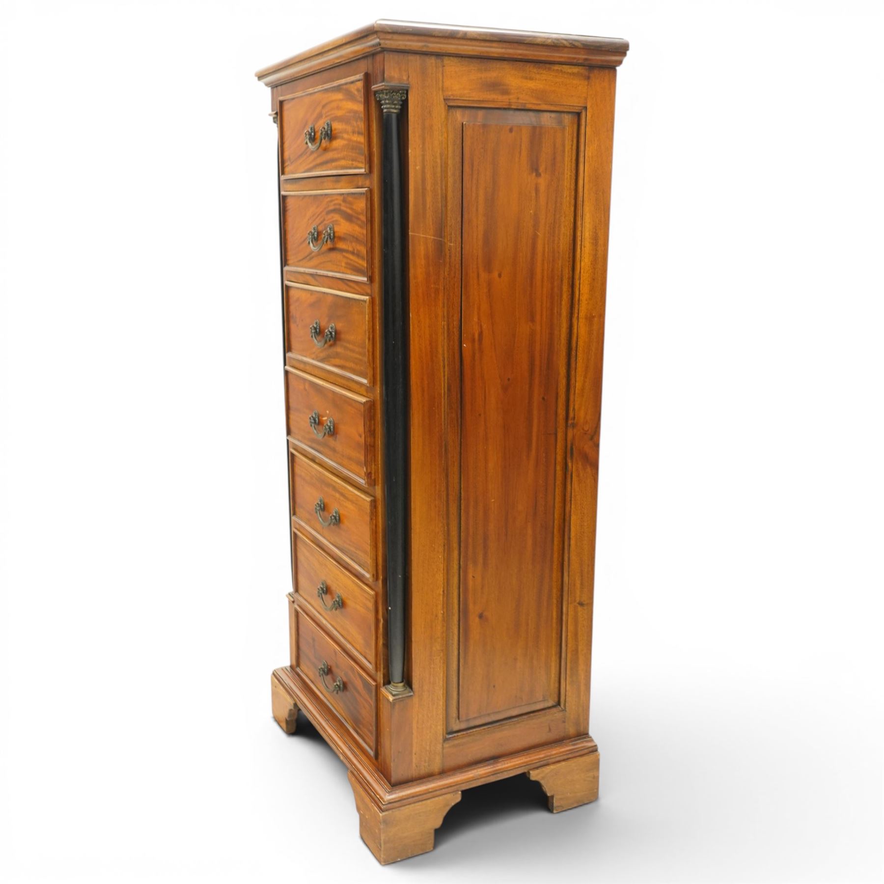 Neoclassical design cherry wood tall pedestal chest, fitted with seven drawers with swan neck handles, flanked by ebonised pilasters with composite capitals, fielded panelled sides on bracket feet