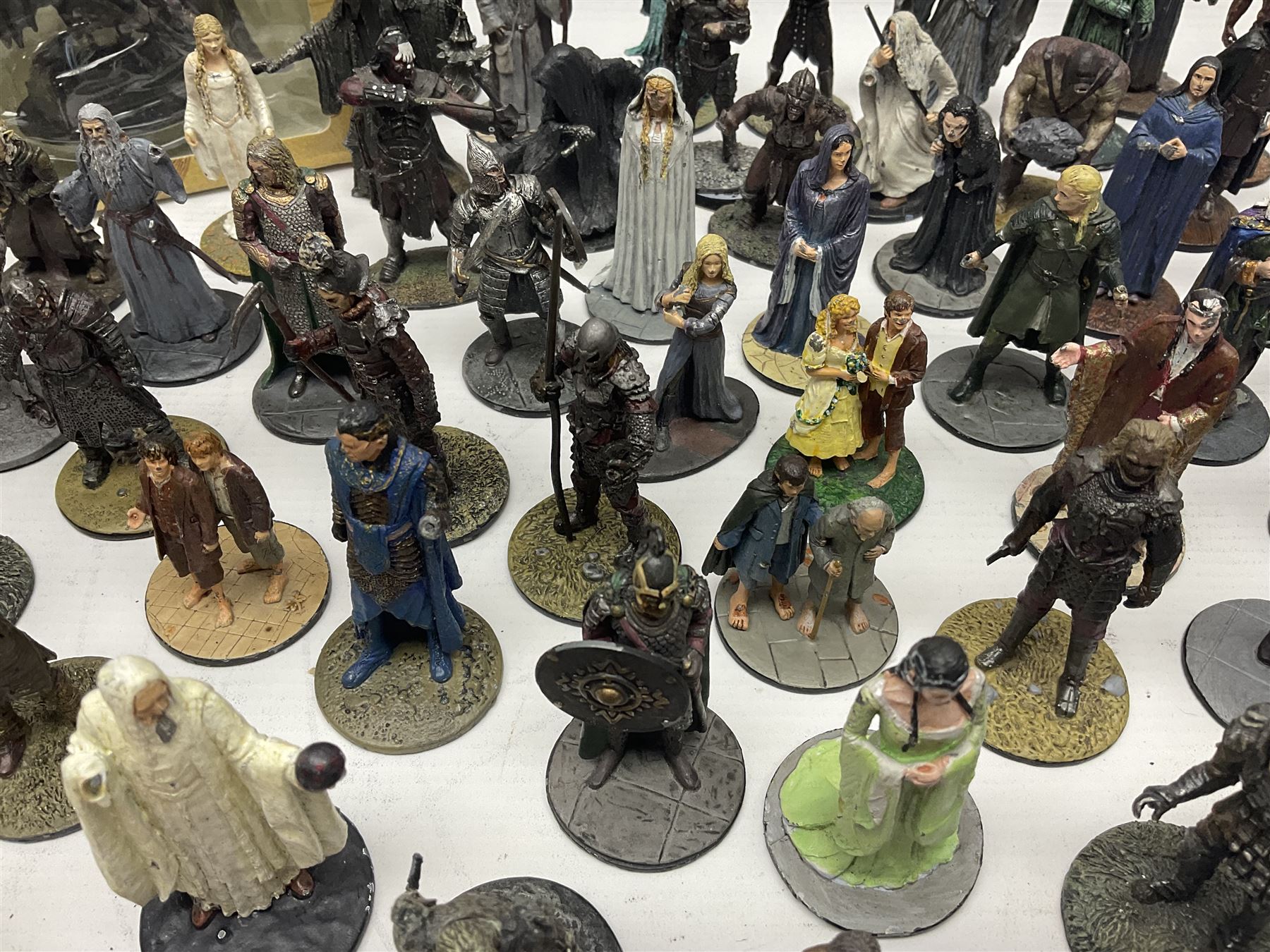 Approximately 80 NLP Lord of the Rings heavy metal painted figurines to include Fell Beast, boxed, and The Watcher, The Dark Lord Sauron, Treebeard etc, and unassociated Dracula themed composite figures marked HHFT50 