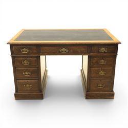 Oak twin pedestal desk with leather top, moulded rectangular top with inset black leather ...
