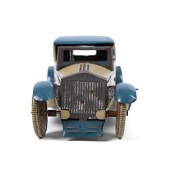 Wells tinplate clockwork limousine, the cream body, with blue roof and lithographed details, with driver and key, H8cm, L23cm