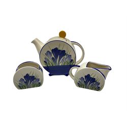 Wedgwood Clarice Cliff bizarre tea wears, comprising blue crocus pattern teapot, milk jug and sugar bowl and blue firs pattern teapot, milk jug and sugar bowl