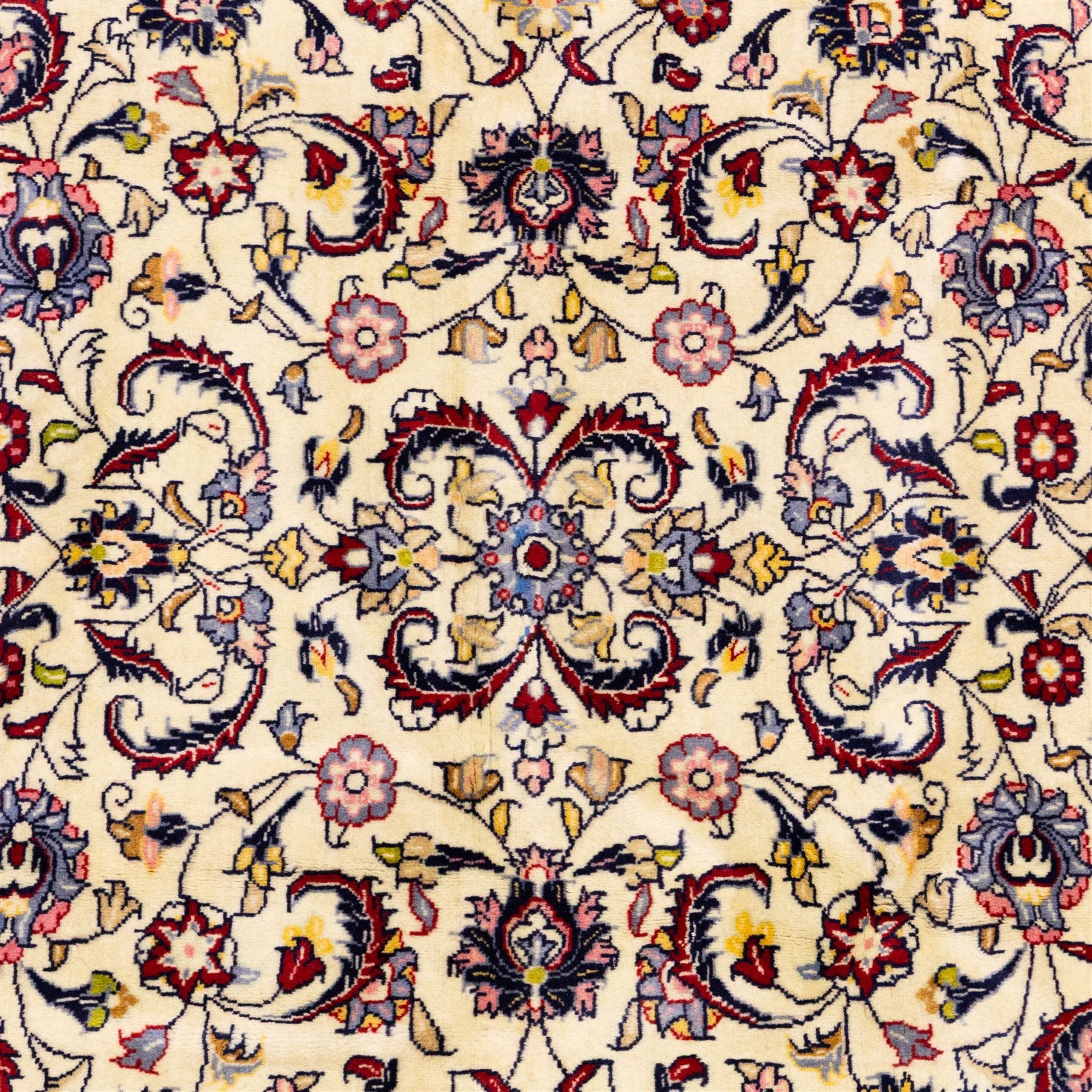 West Persian Sarough hand-knotted rug, ivory field decorated with finely drawn symmetrical lattice of scrolling vines, palmettes and flowering sprays issuing from a subtle central medallion, enclosed by a broad madder-red border of stylized palmettes and foliate vine ornament between multiple guard stripes, with cotton fringe ends 