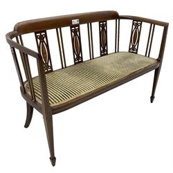 Edwardian inlaid mahogany two-seat salon sofa, curved back and arms inlaid with boxwood stringing, vertical slat back with pierced splats inlaid with satinwood, upholstered seat, on square tapering front supports with spade feet 