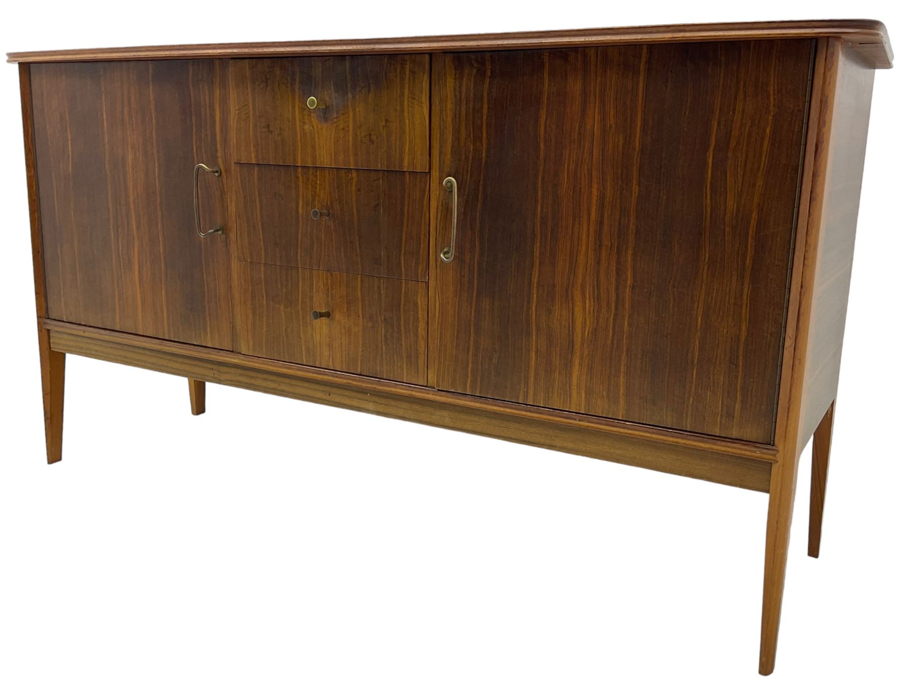 Peter Hayward for Vanson - mid-20th century teak sideboard, rectangular top with rounded corners over three central drawers, flanked by two cupboard doors enclosing shelves, raised on tapered supports