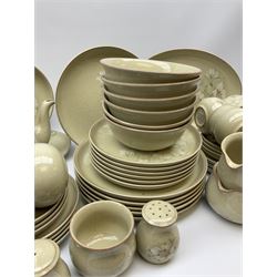 Denby tea and dinner ware decorated in the Daybreak pattern, comprising of tea pot, two jugs, seven cups and six saucers, salt and pepper shakers, four oval platters, six side plates, starter plates, dinner plates and bowls.