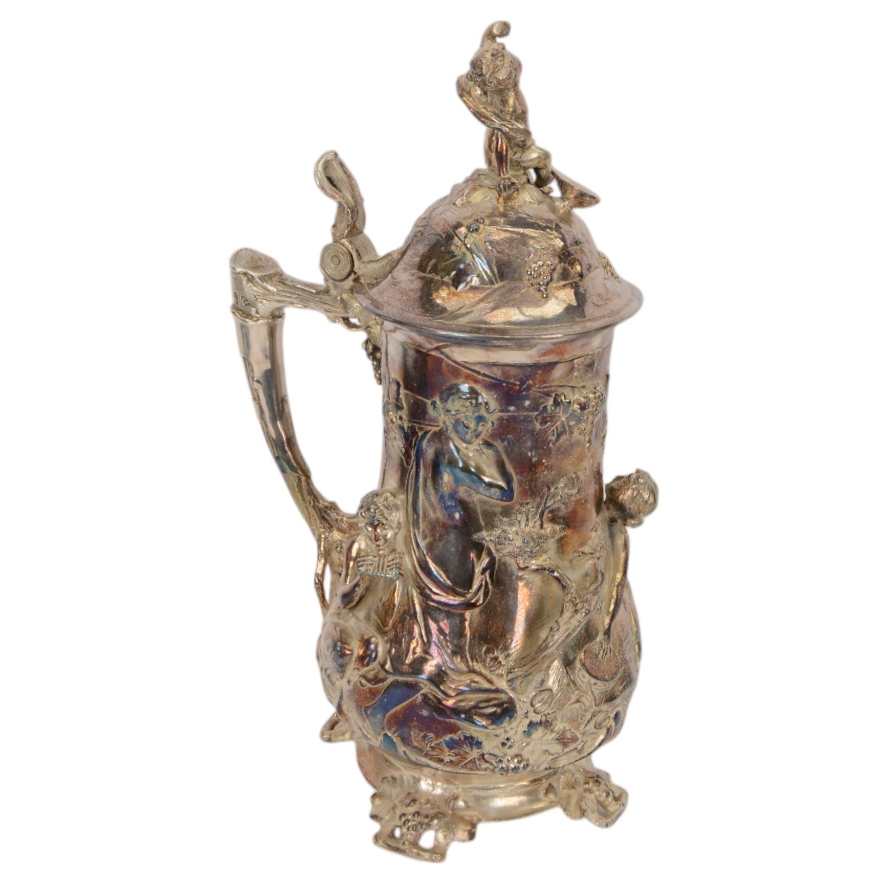 Large late 19th/early 20th century WMF Art Nouveau silver plated stein or jug, circa 1900, the bellied body cast and applied with Bacchanalian figures, the domed cover with putti finial, and handle modelled as a vine, the whole upon four fruit and leaf mounted feet, marked beneath for WMF and engraved with initials CHE and dated 1911, H40.5cm
