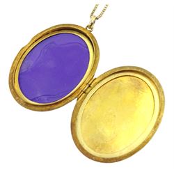 Gold oval locket pendant, on gold wheat link necklace, both hallmarked 9ct