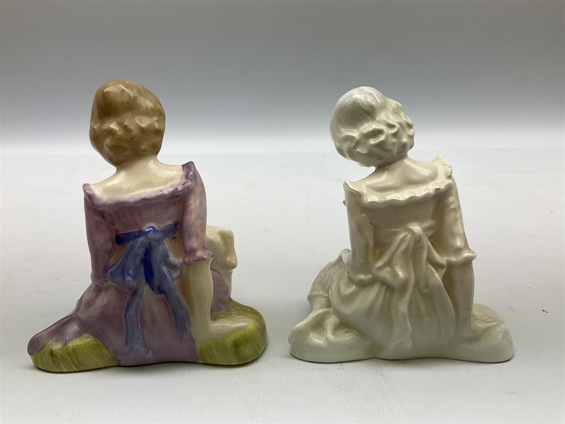 Seven Royal Doulton figures from the Nursery Rhymes Collection comprising, Tom Tom, the piper's son HN3032, Little Jack Horner HN3034, Wee Willie Winkie HN3031, Polly, put the kettle on HN3021, Little Bo-peep HN3030, Little Boy Blue HN3035, Little Miss Muffet HN2727, together with two Royal Doulton Mary had a little lamb figures HN2048 and COPR1948, all with printed marks beneath  