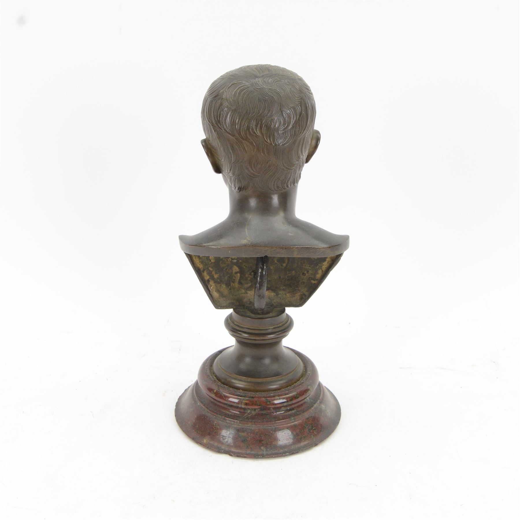 After the Antique, mid/late 19th century bronze portrait bust of a young Julius Caesar, upon a bronze waisted socle, signed L SALVAGGI ROMA, and circular stepped red marble plinth, overall H30.5cm

