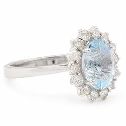 18ct white gold aquamarine and diamond cluster ring, single oval cut aquamarine of approx 2.80 carat, surrounded by fourteen round brilliant cut diamonds, hallmarked, total diamond weight approx 0.60 carat