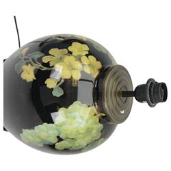 Pair of Jenny Worrall table lamps, of ovoid form, the glass body decorated with fruit and trailing flowers upon a black ground with gilt flecks, with pleated cream lampshades, including shades H65cm