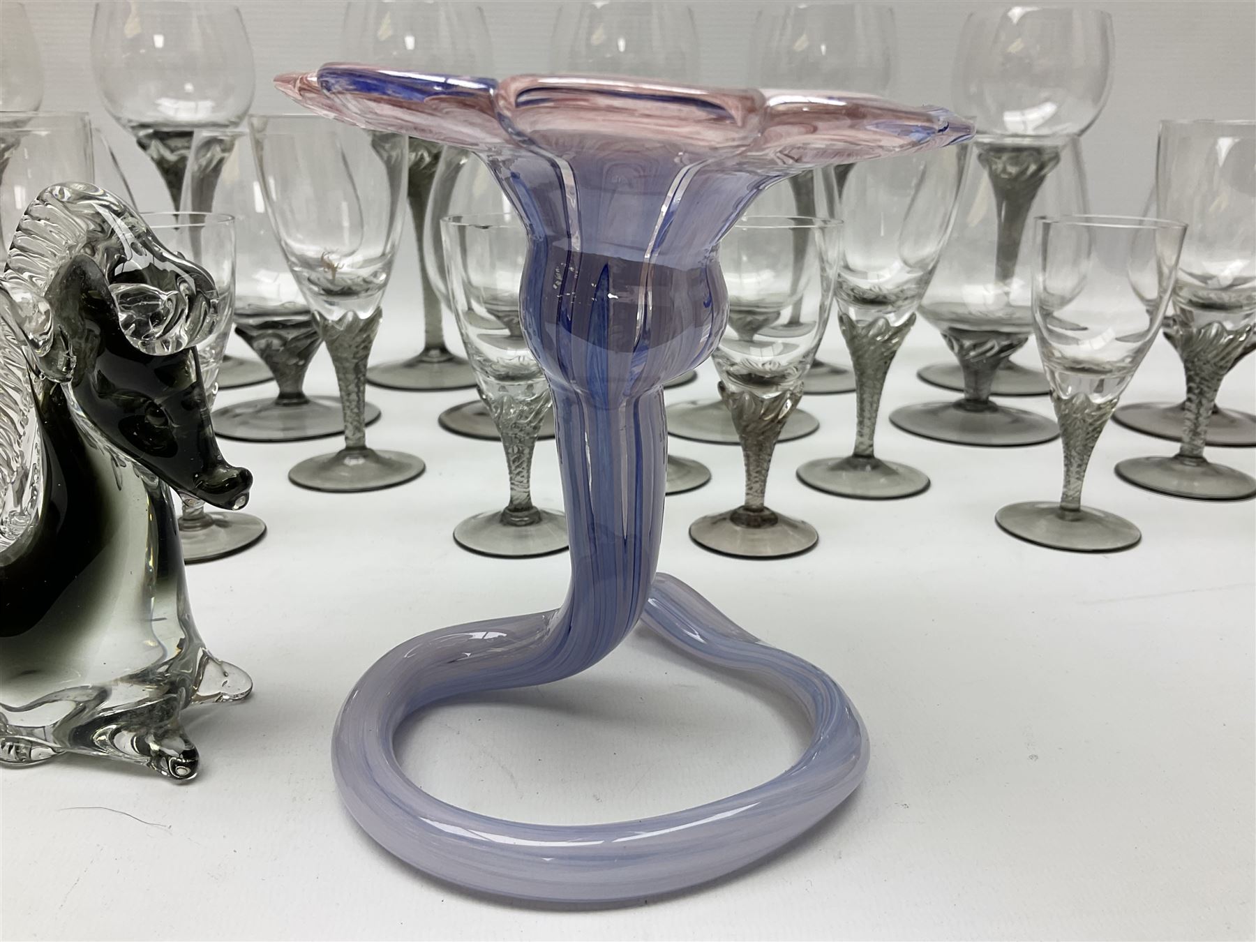 Murano glass figure of a recumbent horse, Murano Lavorazione purple and pink flower, and quantity of matching drinking glasses