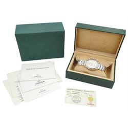 Omega Speedmaster gentleman's stainless steel automatic chronograph wristwatch, back case No. 175.0083, serial No. 57498920, silvered dial with date aperture and subsidiary dials for constant seconds, 30 minute and 12 hour register, stainless steel tachymetre scale bezel, on Omega stainless steel bracelet, with fold-over clasp, with warranty card