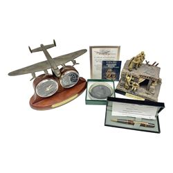 Bradford Exchange 70th Anniversary Lancaster Desk Clock/Barometer; wing span 24cm; with certificate; Corgi Forward March Somme Trench Scene 'Another Day in Hell'; limited edition of 500 with certificate; cased pen handcrafted from a section of oak wood from Messines Ridge (bunker wood prop support); limited edition No.1/6 with certificate; and boxed Bletchley Park souvenir paperweight (4)