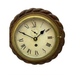 Edwardian - 8-day ships bulkhead clock and an Aneroid barometer.
In matching circular oak cases with carved rope twist bezels.
Clock with a painted metal dial, Roman numerals, minute track and steel spade hands, small seconds hand and platform regulation. Case 9