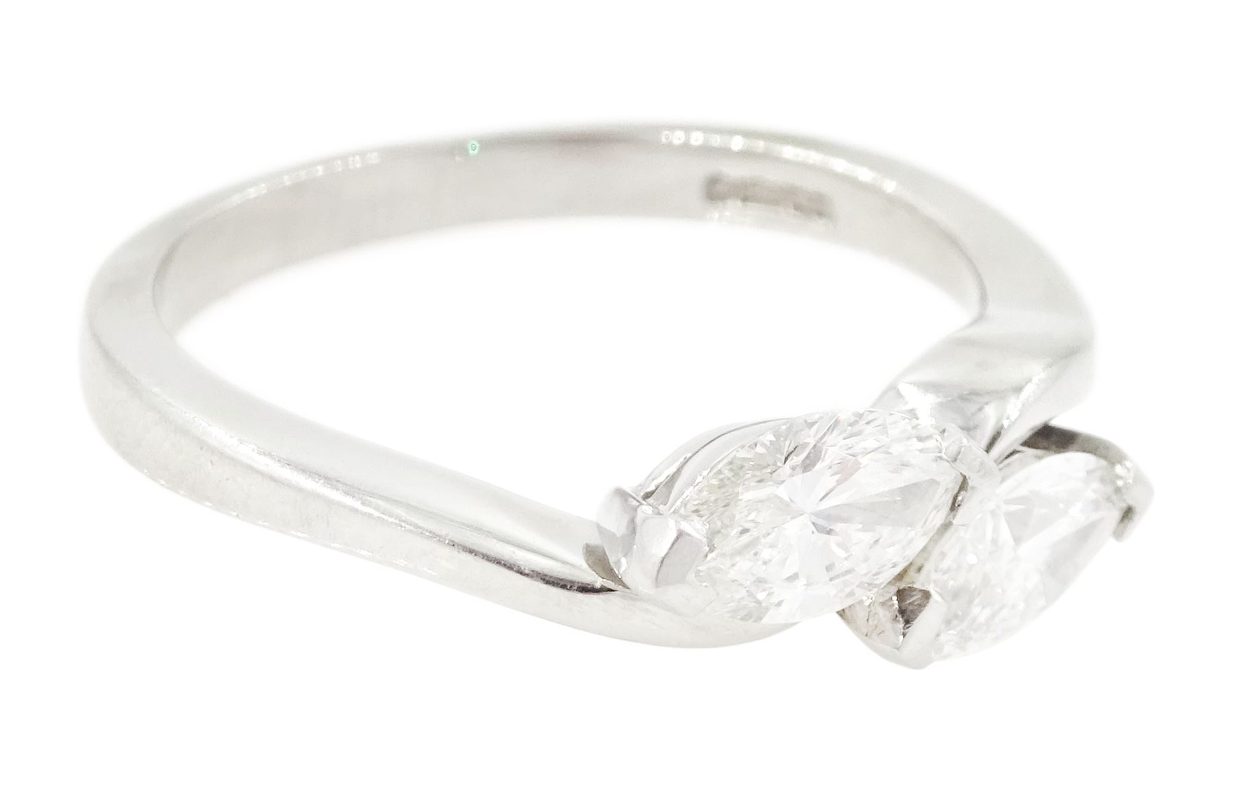 Platinum diamond crossover ring, set with two marquise cut diamonds, London 2010, total diamond weight approx 0.80 carat