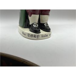 Pair of Royal Doulton Toby Ale Jugs, produced in 1934 for Charrington Ales, together with two circular metal serving trays advertising Charrington brewery, a Charrington badge awarded for 25 years of service and a 1949 menu Fox & Nicholl Ltd annual dinner dance at the toby jug hotel.  