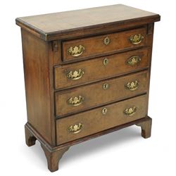 Mid-19th-century Georgian-style burr walnut bachelor's chest with feather-banding, hinged rectangular brushing slide above four graduated long drawers with brass batwing handles and escutcheons, raised on bracket feet  