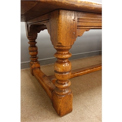  18th century style oak refectory table, cleated solid top on ring turned and block supports joined by a floor stretcher, L230cm W105cm   
