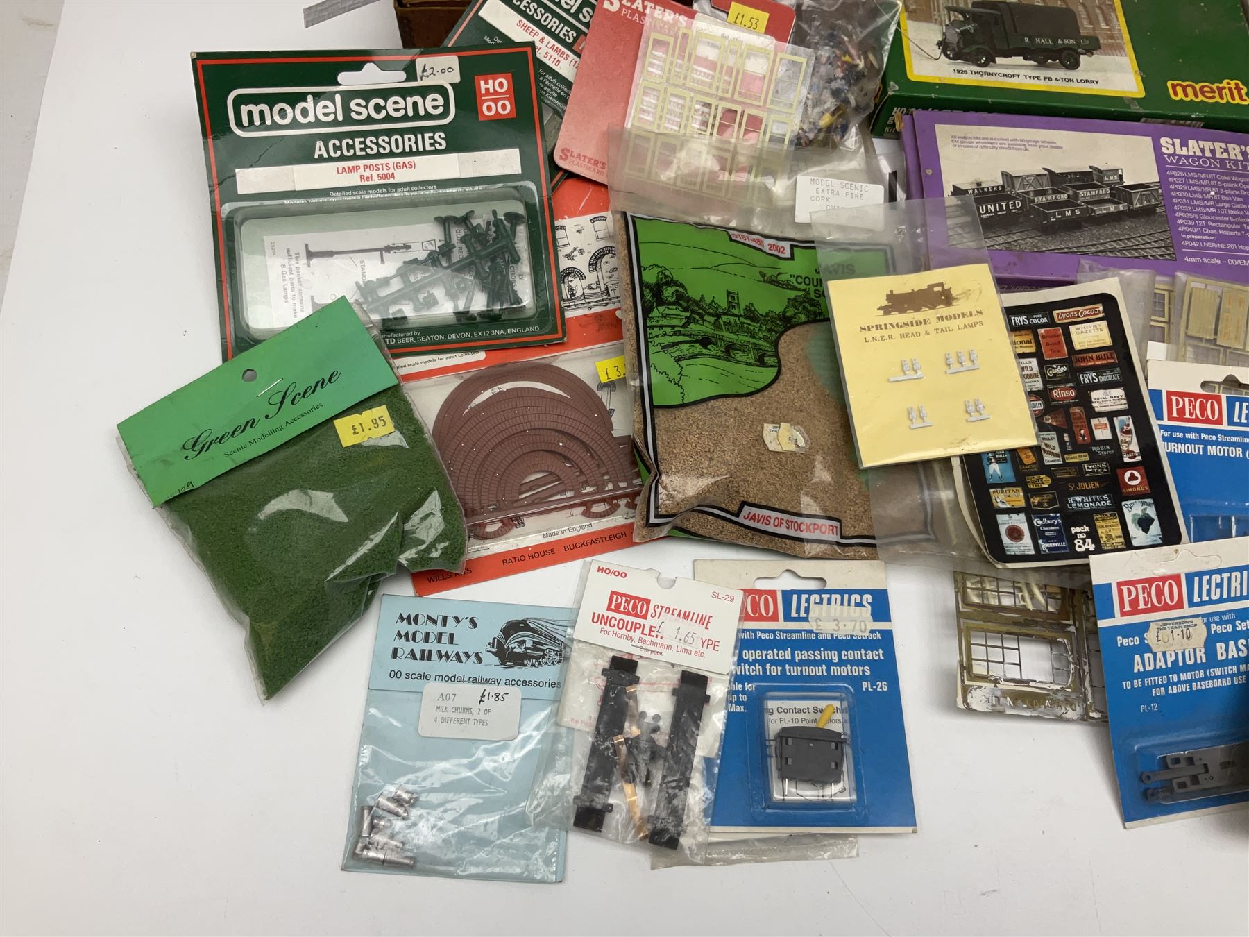 '00' gauge layout accessories - Langley Miniatures Footbridge kit, wagon kits by Nu-Cast, Colin Ashby, Slaters etc, layout chippings, fencing, sprues of figures and accessories, switches and motors, Peco Lectrics, name plates, transfers etc; most boxed or packaged