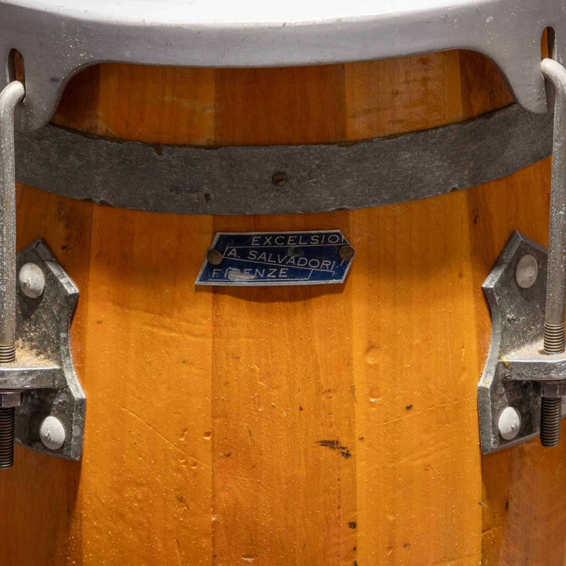 Three conga drums, comprising two Excelsior A. Salvadori Firenze stave-built wooden congas and one similar French example, with skin heads and metal tension mounts, on metal stands with hard carry cases for drums, tallest H79cm, D31cm