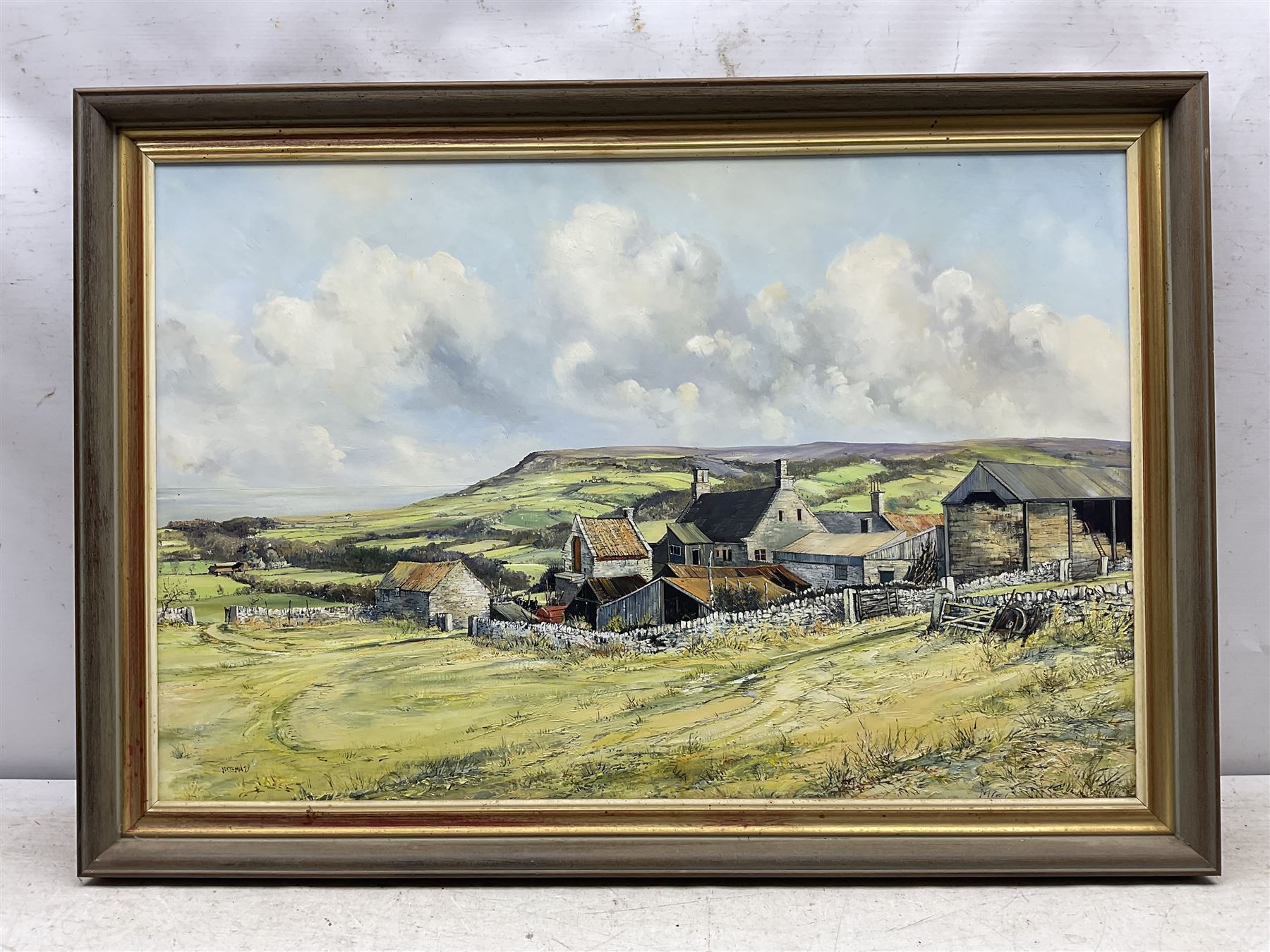 John Freeman (British 1942-):View towards Ravenscar, oil on board signed '79, 49cm x 74cm; together with a signed print (2)