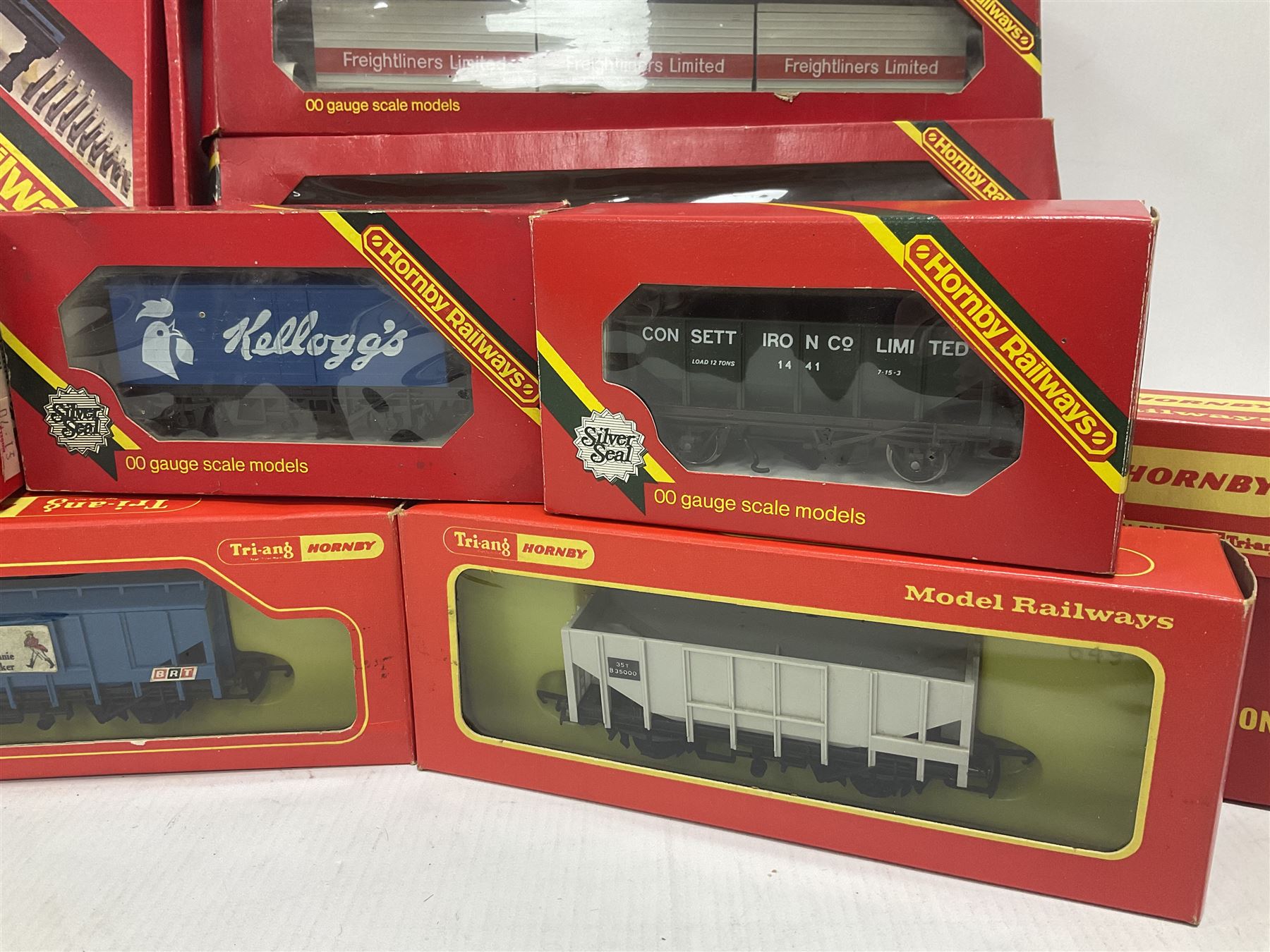 Hornby/Tri-Ang ‘00’ gauge - fifteen goods wagons to include freightliners with containers, ore wagons, closed vans etc; together with R404 Operating ore wagon set; all boxed (16) 