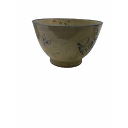 A late eighteenth century English porcelain cup, decorated in the Fisherman and Cormorant pattern, probably Caughley, together with a late 18th/early 19th century pearlware teabowl decorated with floral sprays and sprigs, and two early 19th century Chinese export blue and white cups. (4). 