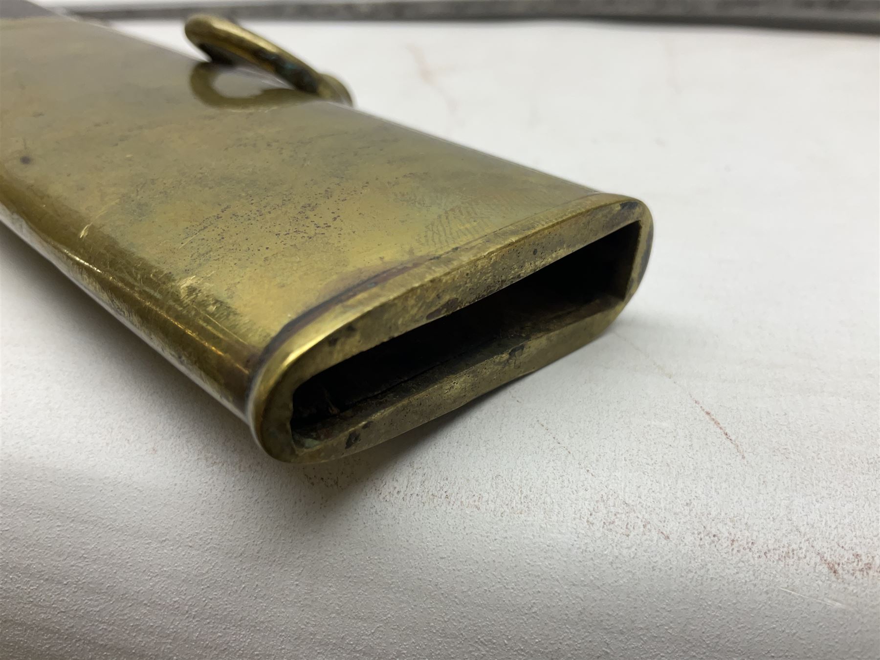 British pattern 1796 Light Cavalry Officer's sword, the 83.5cm curving steel blade marked 'W. Parker London' and 'Warranted' verso, brass stirrup hilt with half-round langets, knucklebow and backstrap with ribbed ivory grip; in brass mounted leather covered scabbard with two suspension rings L97cm overall. This item has been registered for sale under Section 10 of the APHA Ivory Act 