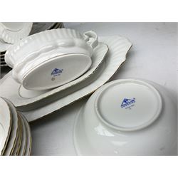 Chodziez Polish dinner wares decorated in white and gilt to include lidded twin handled tureens, bowls, plates etc