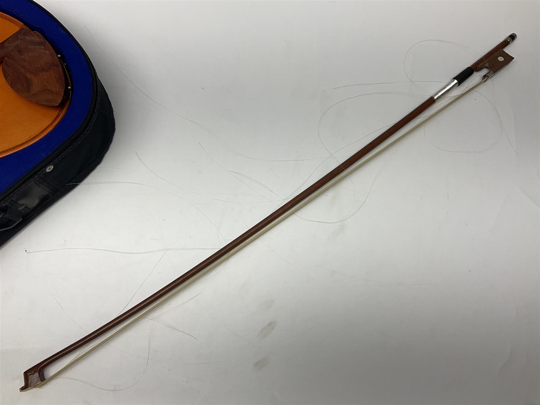 Three Stentor Student violins - three-quarter size with 33cm two-piece back; and two quarter size each with 28cm two-piece back; each in carrying case with bow (3)