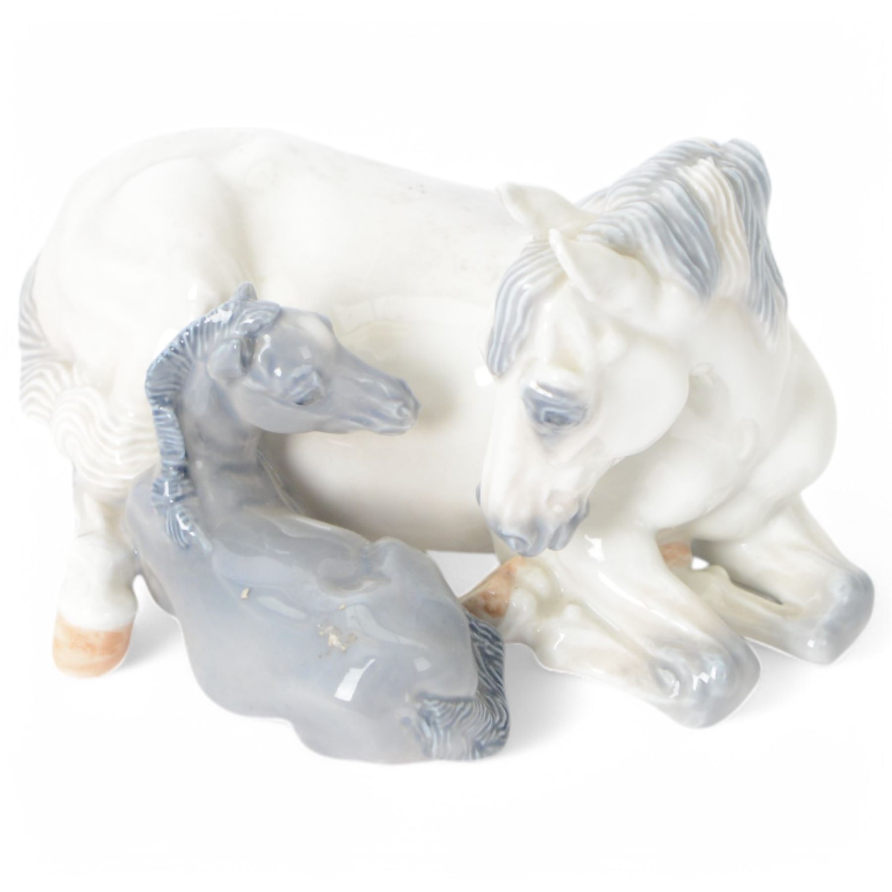 Five Royal Copenhagen figures, including Mare and Foal no.698, Goat and Kid no. 4744, Fox and Cubs no.1788