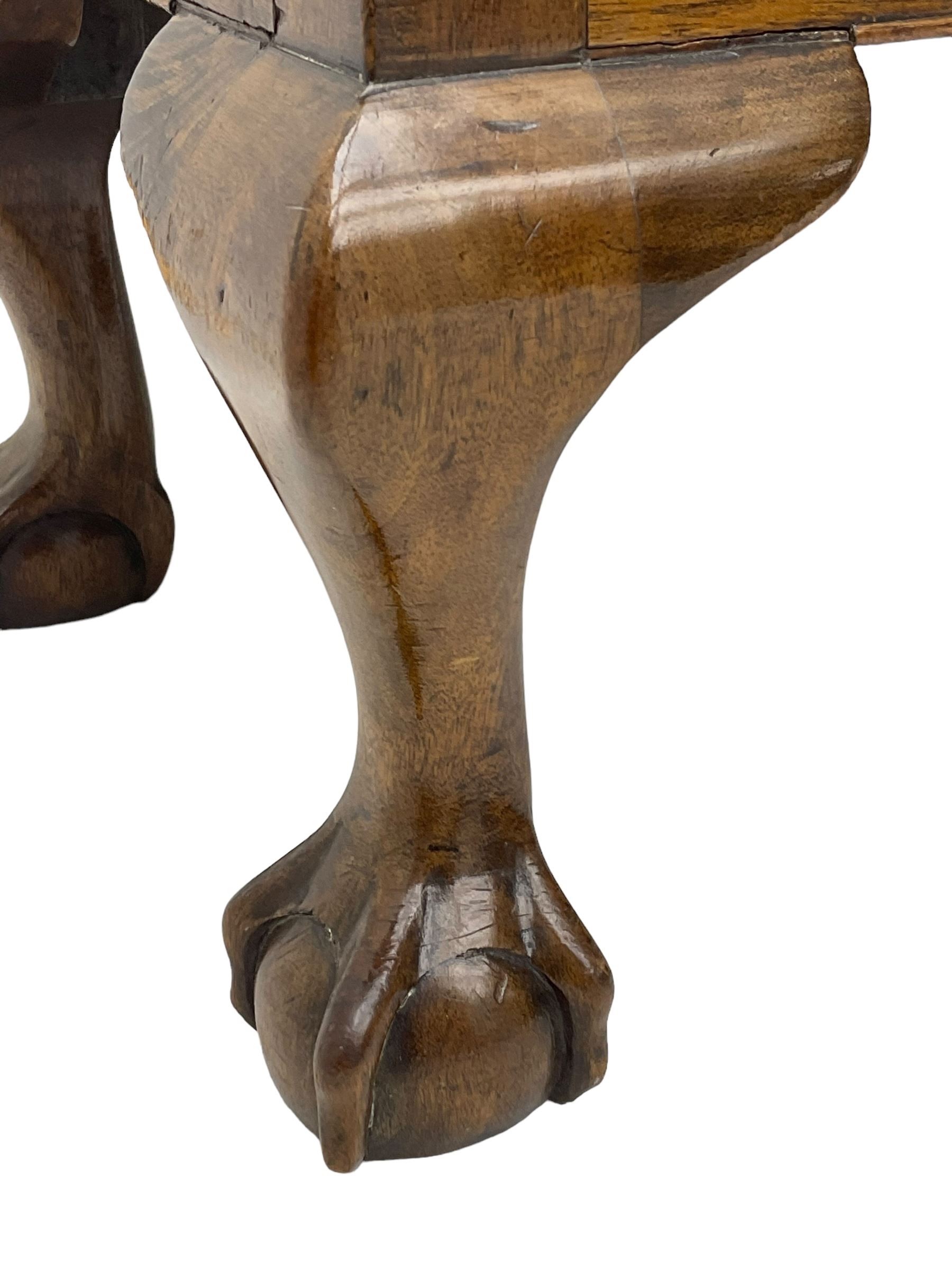 20th century mahogany rectangular footstool, needlework upholstered drop-in seat, on ball and claw carved feet (W81cm, D35cm, H34cm); 19th century elm stool, needlework upholstered drop-in seat, on square moulded supports united by plain stretchers (W45cm); 19th century walnut stool, shaped top upholstered in needlework, on cabriole supports (W50cm); 19th century rosewood stool, upholstered drop-in seat, on curved x-framed supports united by turned stretcher (W47cm)