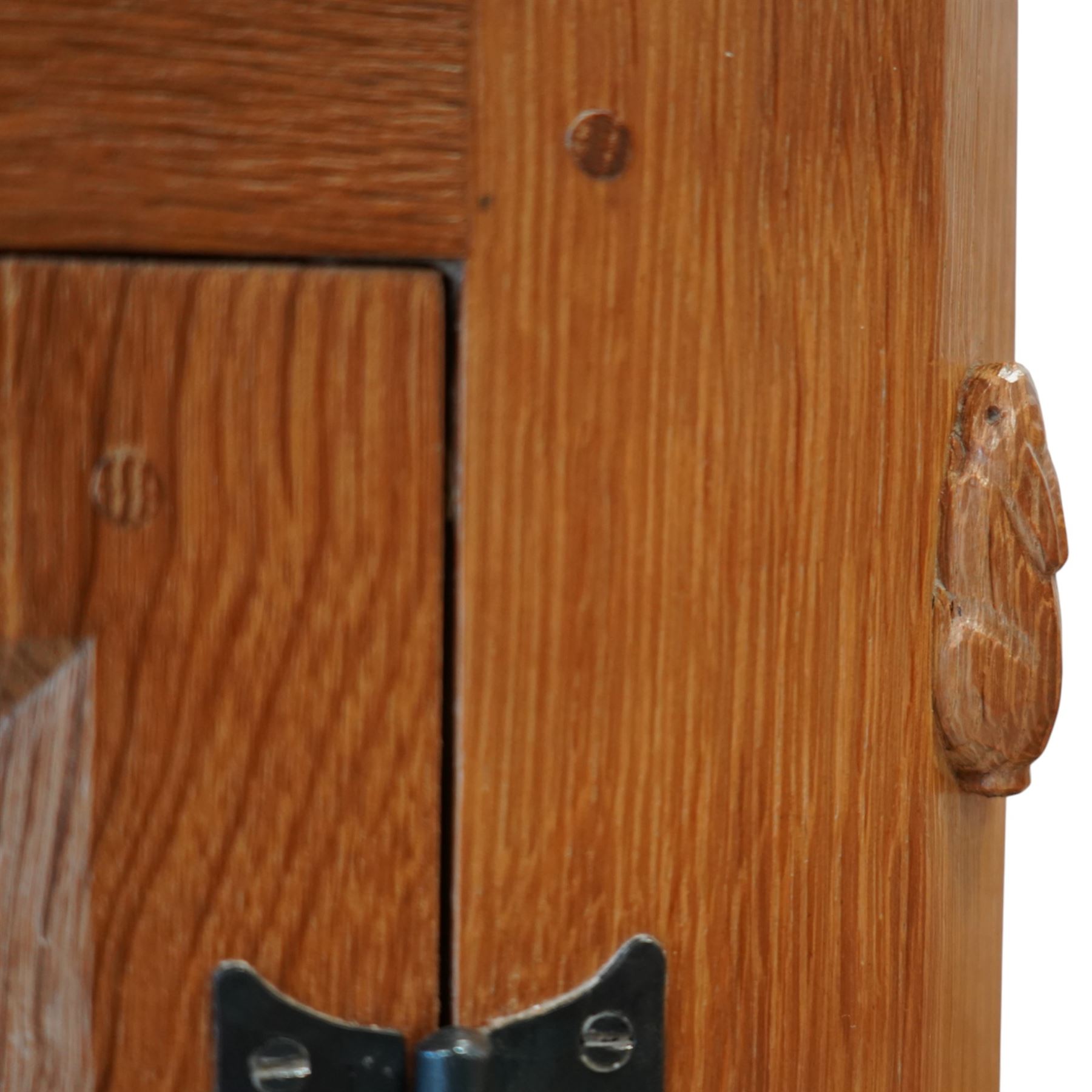 Rabbitman - oak sideboard adzed top with galleried top, with three graduating drawers to the centre, flanked by two panelled and lightly adzed doors, iron latches and hinges, raised on tapered stile supports, with carved rabbit signature, by Peter Heap of Wetwang   