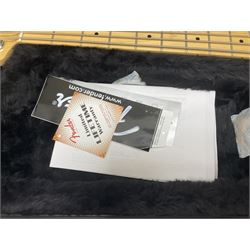 Fender Precision Bass guitar, in Olympic White finish with tortoiseshell effect scratchboard, serial no US15103092, in black Fender hard case with Fender strap and warranty card, guitar L116cm