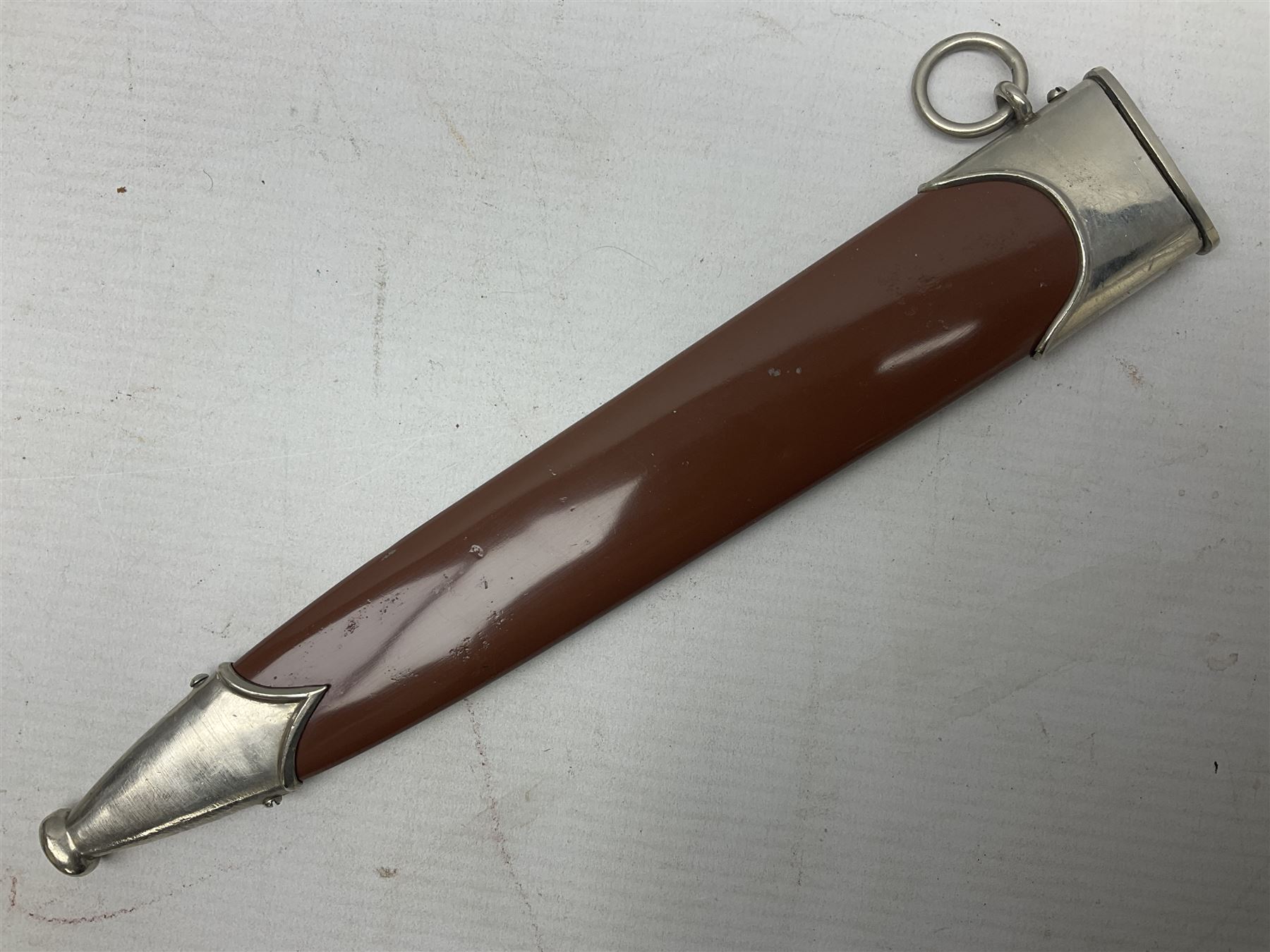 WW2 German SA dagger the 22cm double edged steel blade by G. Felix Gloriawerk Solingen inscribed 'Alles Fur Deutschland', the cross-piece impressed with the SA Gruppen mark Nm verso for Nordmark, wooden grip inset with eagle and SA emblem; in brown painted scabbard with nickel mounts L37cm overall