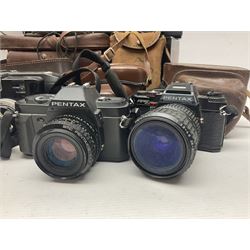 Collection of cameras and lenses, to include Pentax Program A camera body, serial no 123759, with 'Pentax-A zoom 1:3.5-4.5 28-80mm' len, Praktica EE2 camera body with 'Pentacon electric 1.8/50' lens etc, together with a Manfrotto tripod 