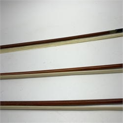 Three pernambuco bows by F.C. Pfretzschner with silver mounts, Adolf Thoma and Tourte