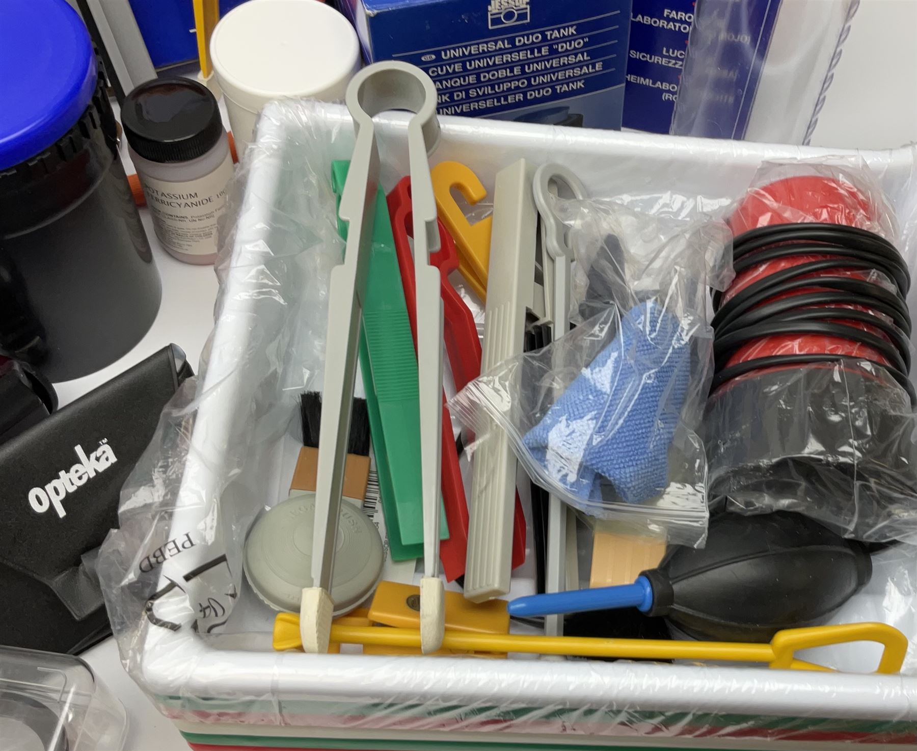 Vintage and later cameras, lenses, accessories and darkroom equipment including Zenit 12XP camera, Praktica BX20 camera fitted with 'Sigma Zoom Master 1:3.5-4.5 f=35-70mm' lens, Praktica LLC camera fitted with 'Carl Zeiss Jena Pancolar 1.8/50' lens, Canon Zoom Lens 'EF 100-300mm 1:5.6', various Jessop and other makers darkroom items including safelight (Red), universal duo tank, multi-mask enlarging easel etc, in three boxes