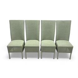 Set of four Lloyd Loom dining chairs, each with woven high back and seat in sage green finish, raised on matching painted tubular supports
