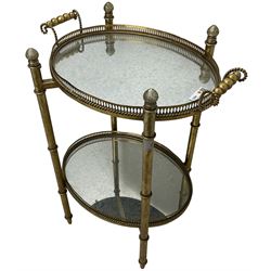 Gilt metal oval stand, two mirrored tray tiers with raised pierced galleries
