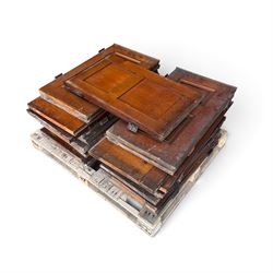 Collection of approximately twenty stained pine Victorian pew end doors or shutters, each ...