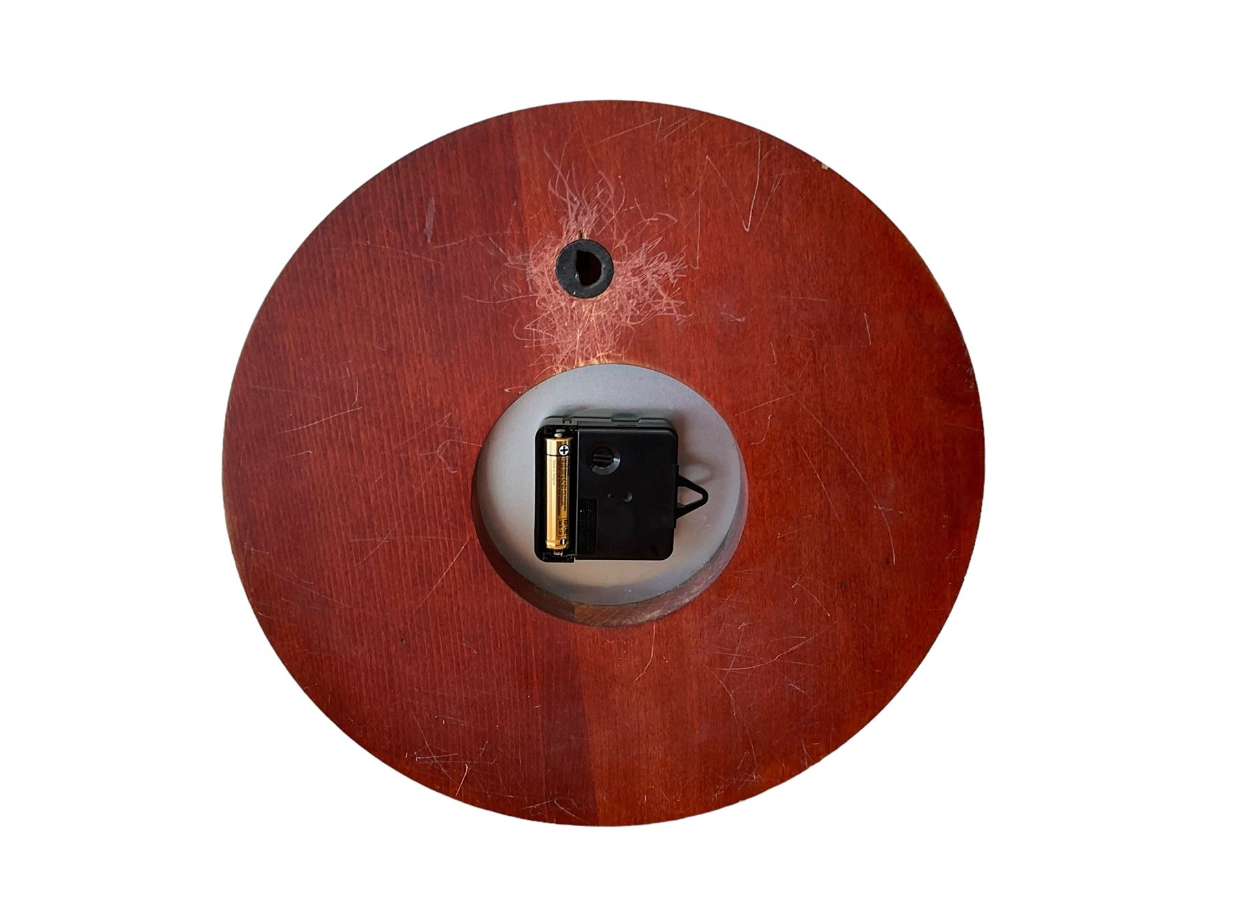 20th century marine clock with a mahogany surround and cast brass “porthole” bezel, with a 6” dial and Swiss battery operated quartz movement.