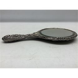 Silver mounted dressing table mirror, embossed with birds, masks, and foliate and C scrolls, hallmarked Birmingham, and fruit knife with mother of pearl handle and silver blade, (2)