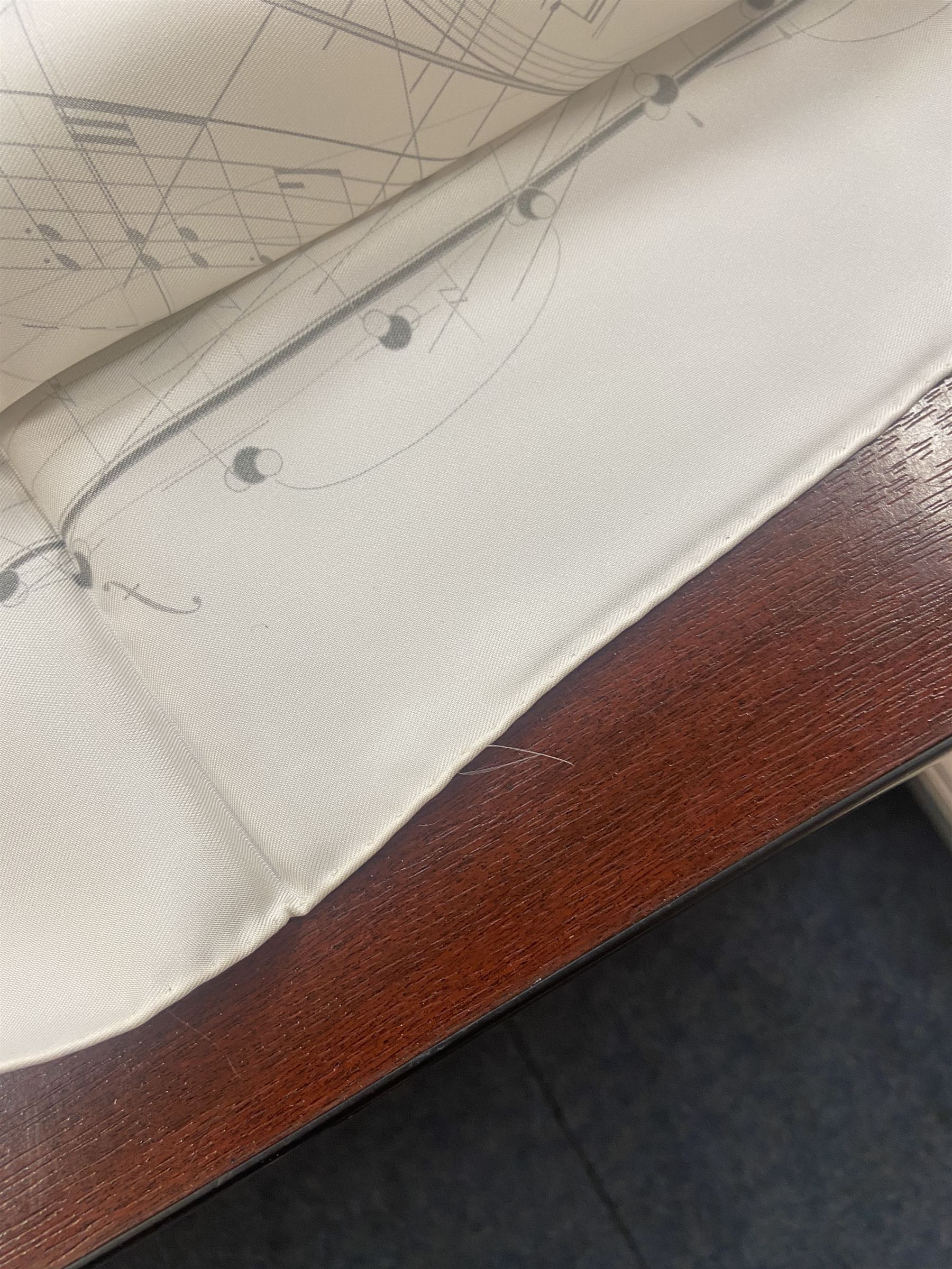 Hermès 'La Musique Des Spheres' silk scarf, designed by Zoe Pauwels in 1996, printed with a Viola Medici surrounded by musical motifs in black, on ivory white ground, with rolled hand stitched edges and Hermes material label, 87cm square