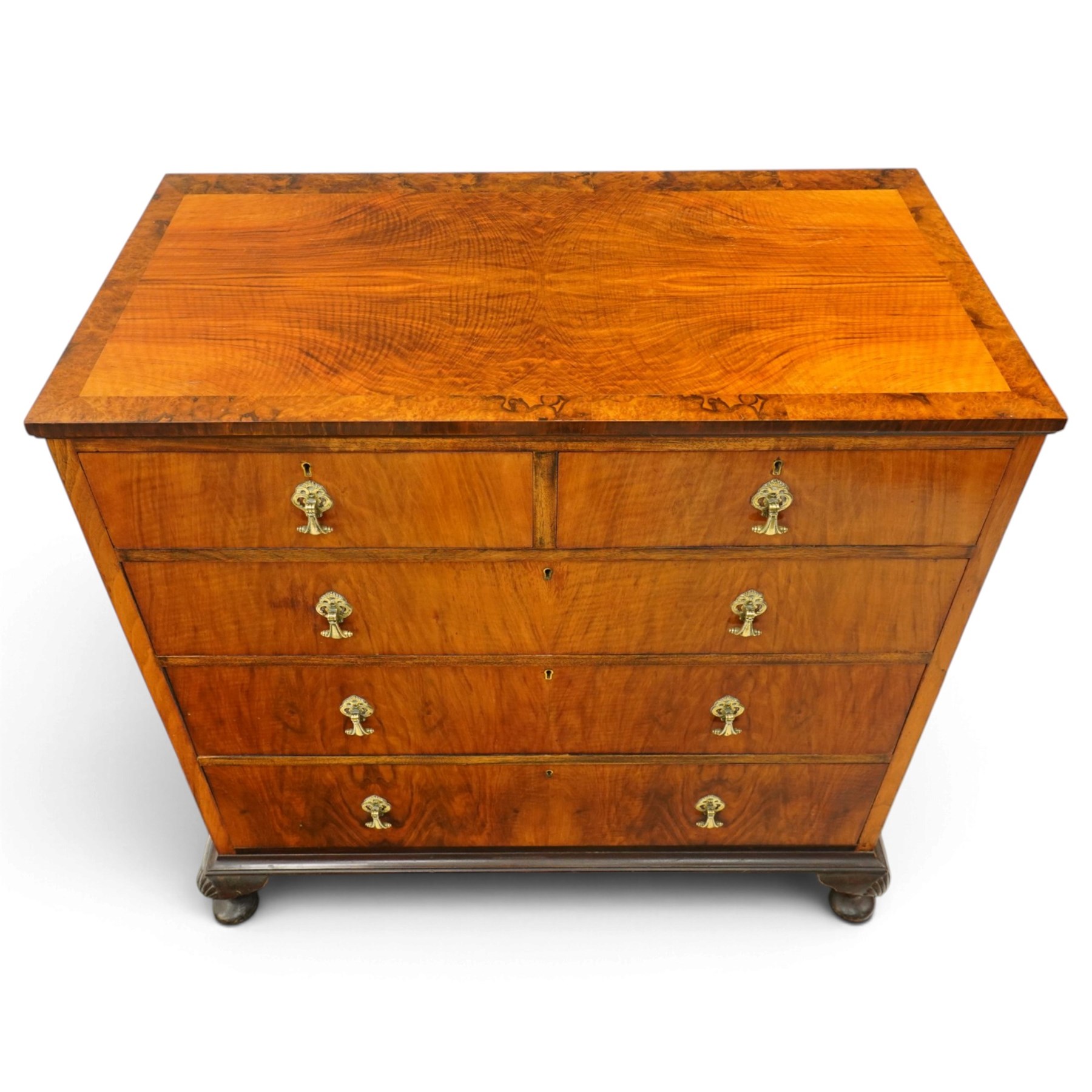 Early 20th century figured walnut chest, rectangular top with burr crossbanding, fitted with two short over three long drawers with brass drop-handles, lower moulded edge over shell-carved cabriole feet