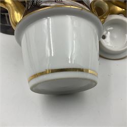 Two 19th century continental teapots and warmers, each teapot upon a cylindrical warming base in the form of a castle, hand printed with winter landscapes, largest H22cm 